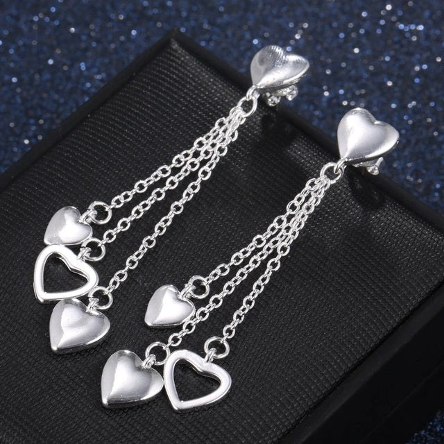 Elegantly Designed Sterling Silver Earrings with Dangling Open and Solid Hearts