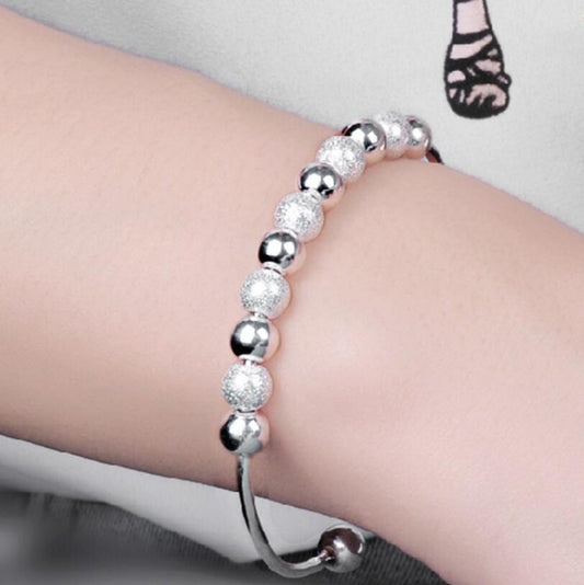 Elegant Sterling Silver Bracelet with 11 Delicate Beads