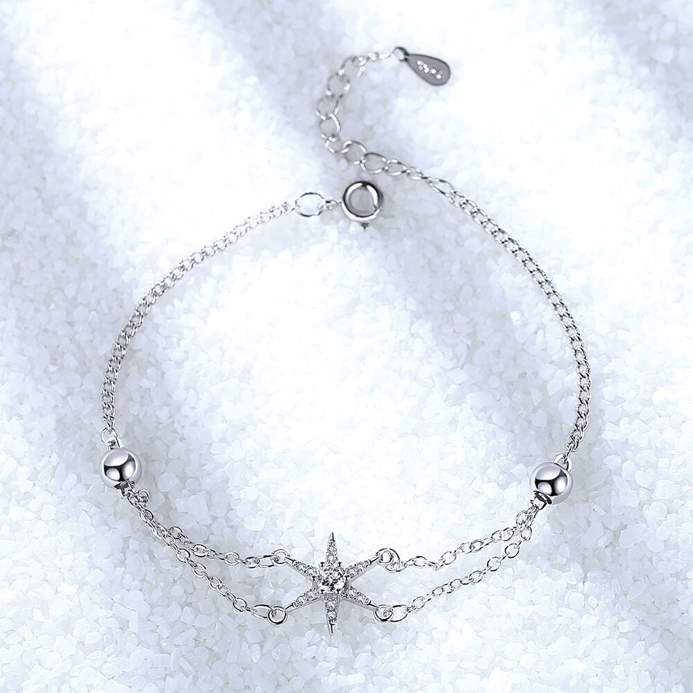 Elegant Sterling Silver Bracelet with Star Charm and Synthetic Stones