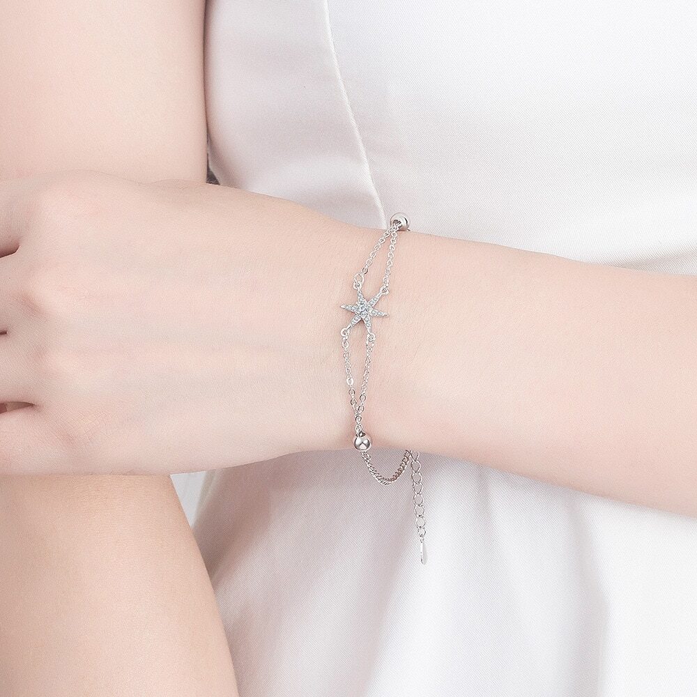 Elegant Sterling Silver Bracelet with Star Charm and Synthetic Stones