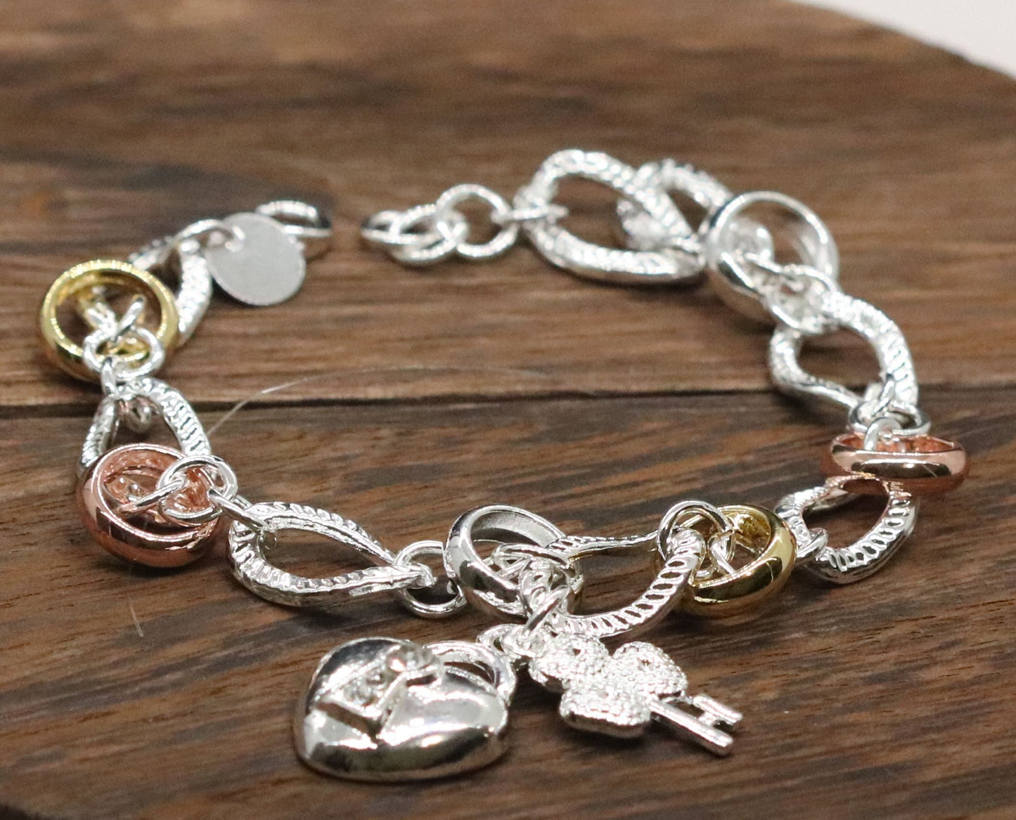 Beautifully Crafted Sterling Silver Two Tone Silver/Rose Silver Link Bracelet with Shamrock & Heart Key Charms.