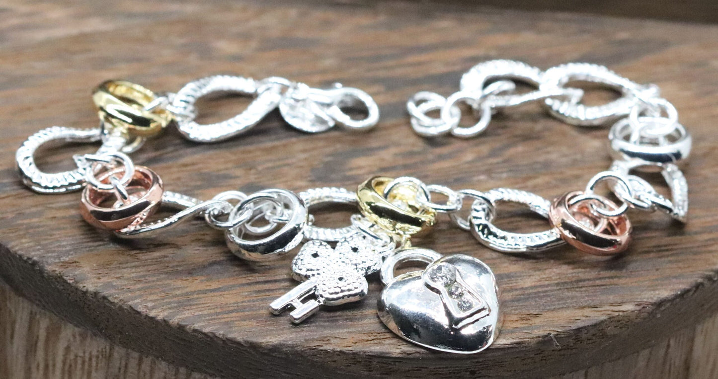 Beautifully Crafted Sterling Silver Two Tone Silver/Rose Silver Link Bracelet with Shamrock & Heart Key Charms.