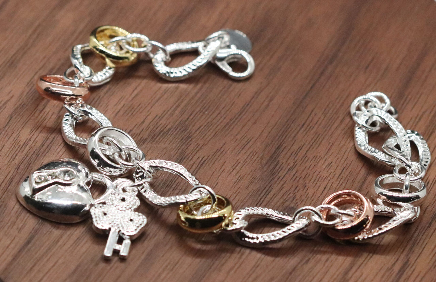 Beautifully Crafted Sterling Silver Two Tone Silver/Rose Silver Link Bracelet with Shamrock & Heart Key Charms.