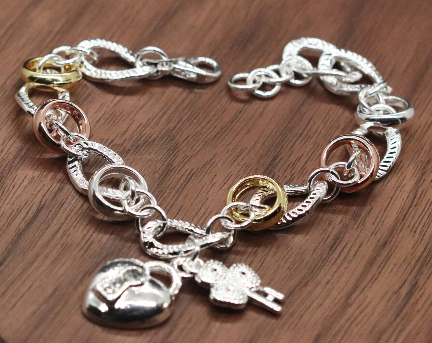 Beautifully Crafted Sterling Silver Two Tone Silver/Rose Silver Link Bracelet with Shamrock & Heart Key Charms.