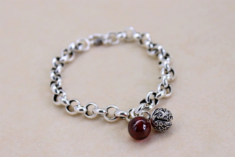 Elegant Sterling Silver Bell Bracelet with Red Stone