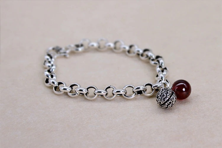 Elegant Sterling Silver Bell Bracelet with Red Stone