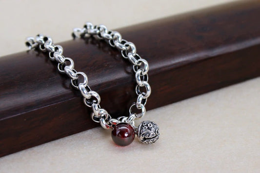 Elegant Sterling Silver Bell Bracelet with Red Stone