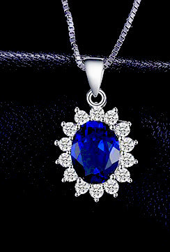 Sterling Silver Oval Shaped Lab Created Non-Treated Sapphire Accented with 14 Round Cubic Zirconia Stones on 18" Box Chain. Origin of Stone Switzerland