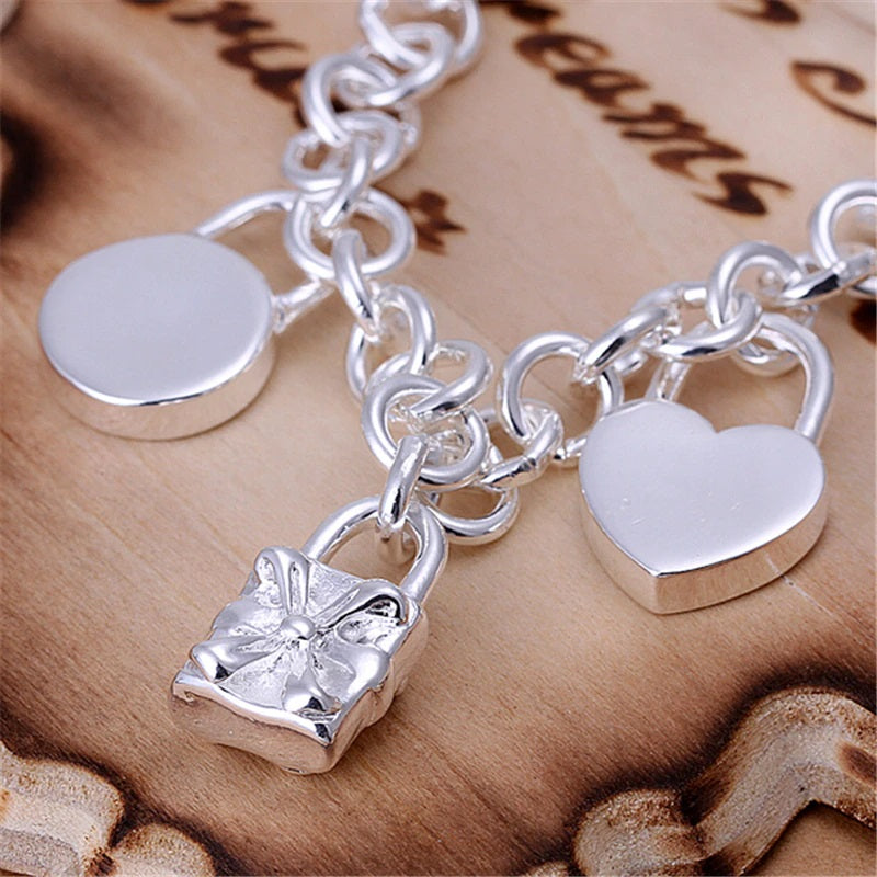 Beautiful Sterling Silver Charm Bracelet with an Assortment of Charming Heart, Square, and Lock Charms