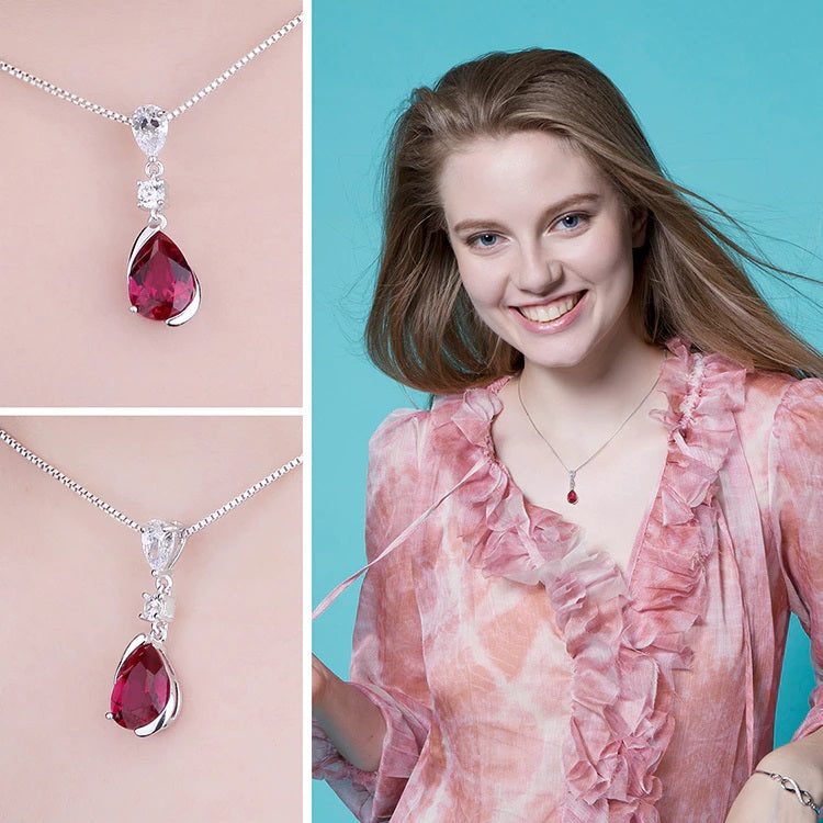 Sterling Silver Pear Shaped Ruby Lab Created Non-Treated Accented with Two Round Cubic Zirconia Stones on 18" Box Chain. Origin of Stone China