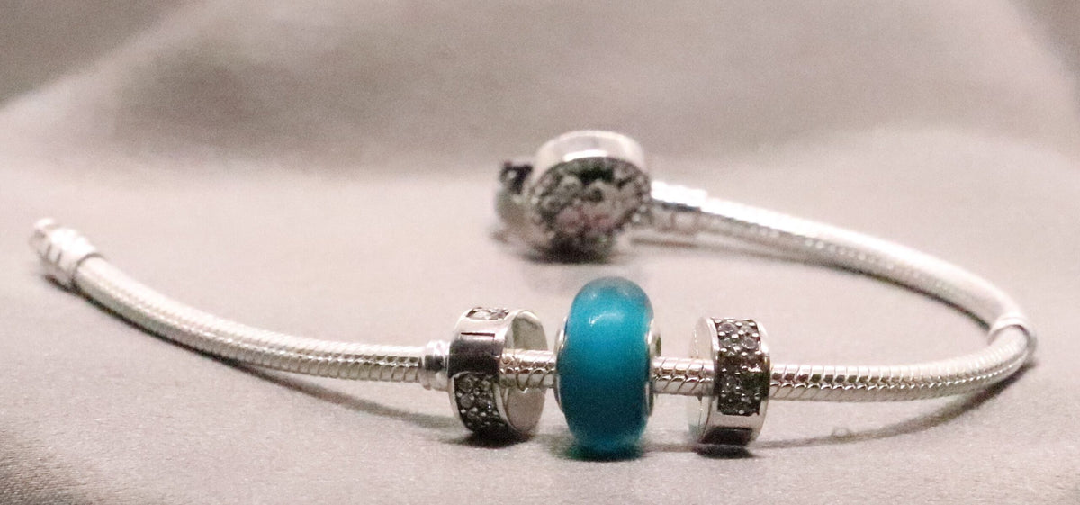 Fashionable Sterling Silver Snake Charm Bracelet with CZ and Green Charm Bead