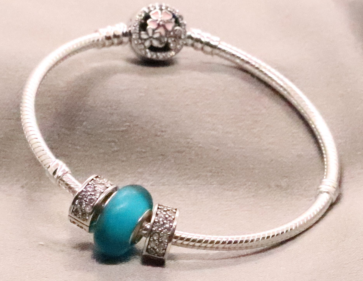 Fashionable Sterling Silver Snake Charm Bracelet with CZ and Green Charm Bead