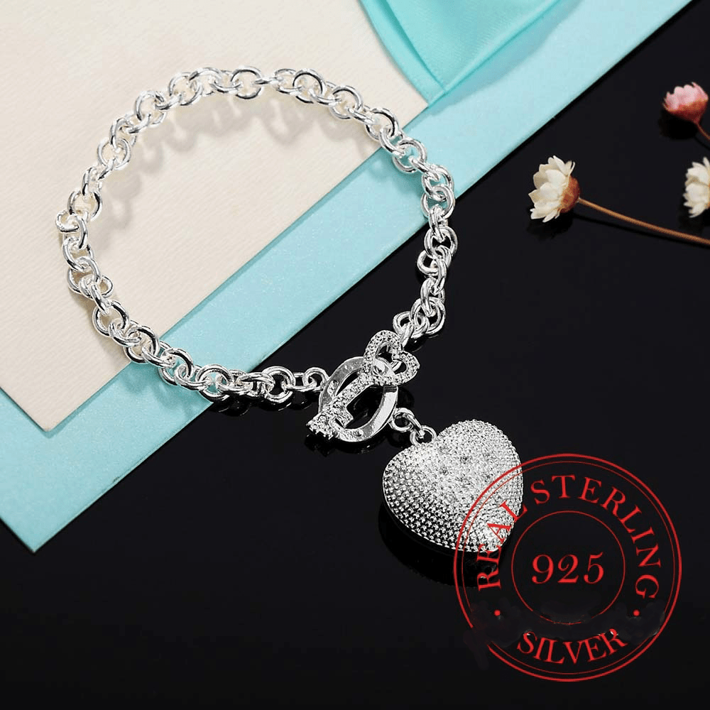 Key to My Heart Sterling Silver Puffed Heart Bracelet with Cut-Out Hearts & Florentine Finish