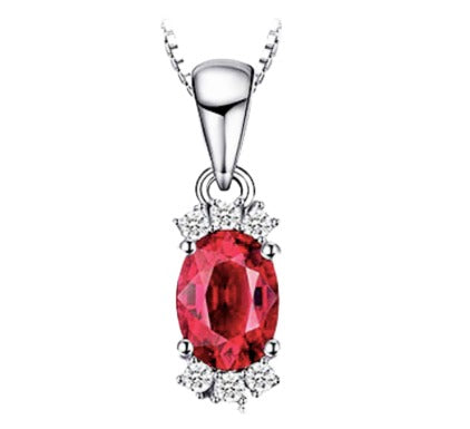 Sterling Silver Oval Shaped Natural Garnet Accented with Six Cubic Zirconia Stones on 18" Box Chain. Origin of Stone Mozambique