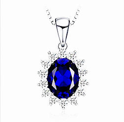 Sterling Silver Oval Shaped Lab Created Non-Treated Sapphire Accented with 14 Round Cubic Zirconia Stones on 18" Box Chain. Origin of Stone Switzerland